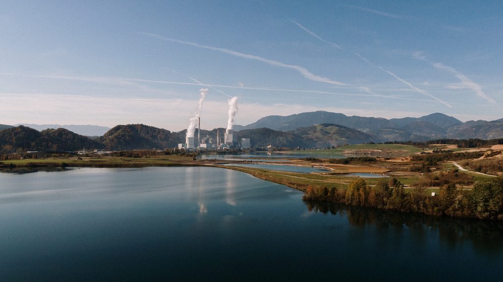 aerial shot landscape surrounded by mountains lakes with industrial disaster